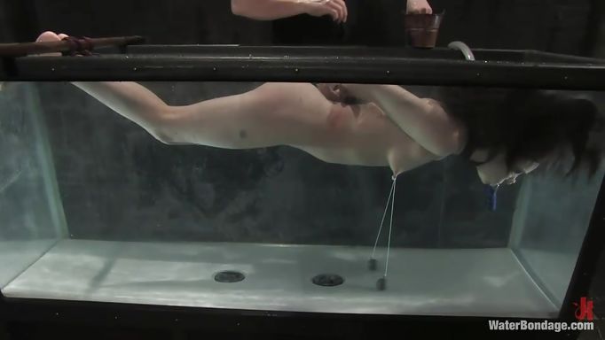 Naked Brunette Tied And Submersed In Water