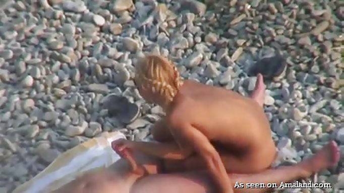 Blonde Babe Caught Riding Cock On The Beach