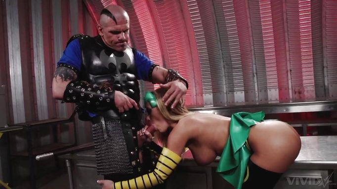 A Blonde In A Costume Performs Oral Sex On A Bald Man